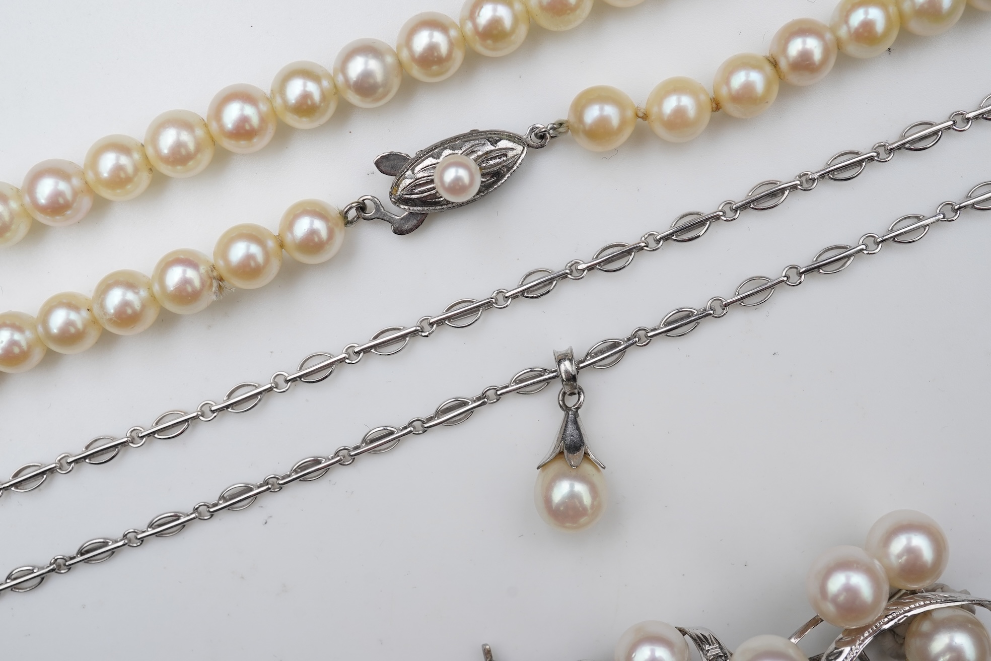 A collection of cultured pearl jewels and a cameo pendant